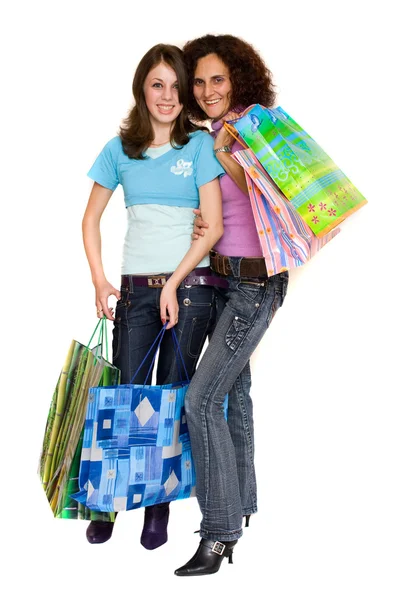 Jovens mulheres fazendo compras, isoladas em branco — Fotografia de Stock