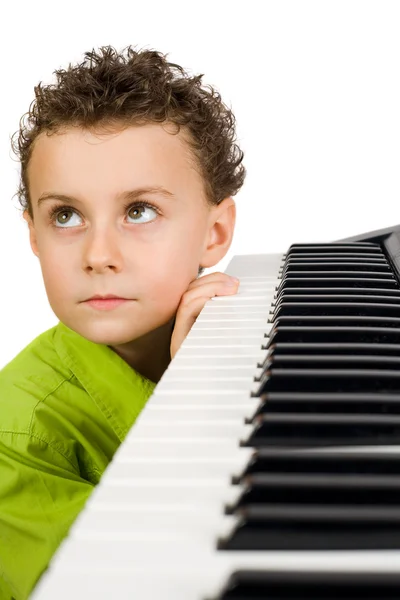 Cute kid playing piano — Stock Photo, Image