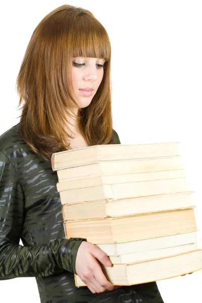 Estudante com uma pilha de livros — Fotografia de Stock