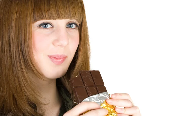 Girl eating chocolate — Stock Photo, Image