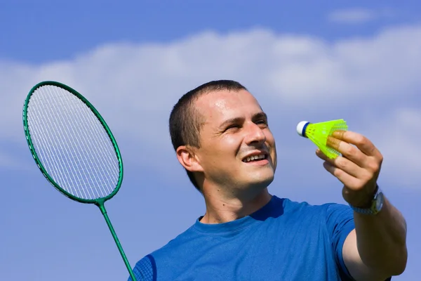 Young man playing badminton — Stock Photo, Image