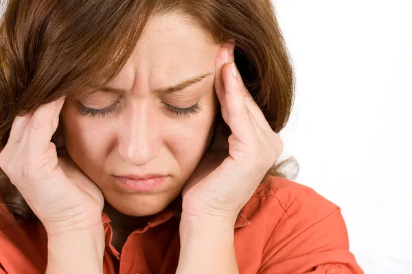 Frau mit Kopfschmerzen Stockbild
