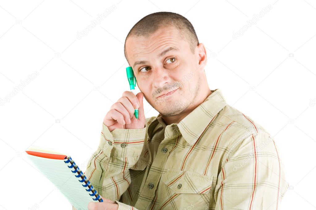 Young casual businessman writing