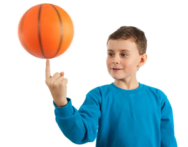 Kid spinning basketball with motion blur — Stock Photo, Image