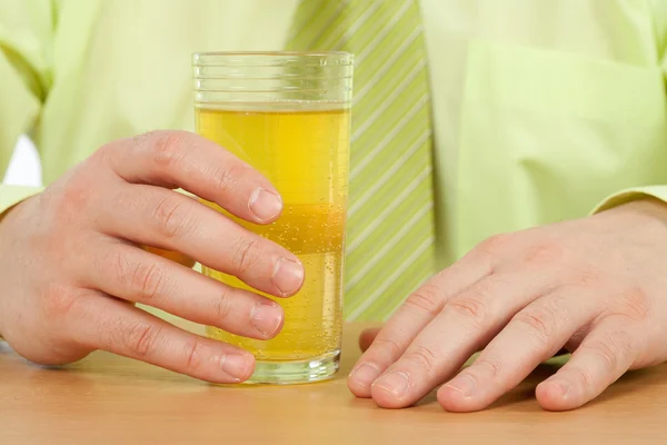 Hand on a glass with fresh drink — Stock Photo, Image