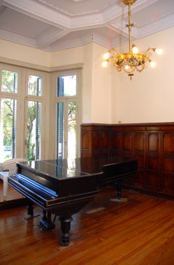 Grand piano in a luxury home clipart