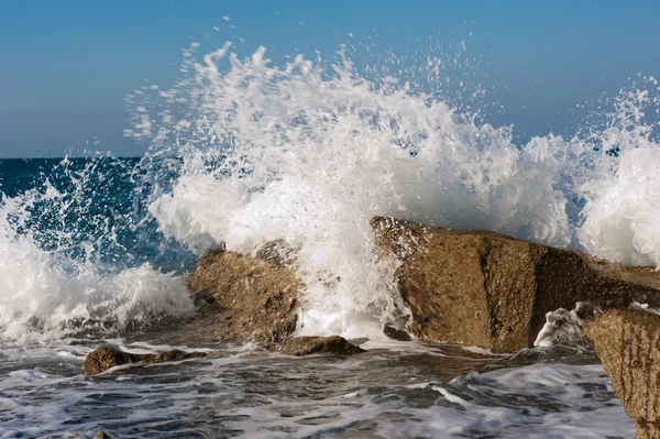 stock image Wave Smashing Rocks