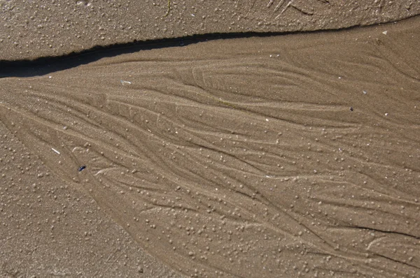 Мокрий пісок фону — стокове фото