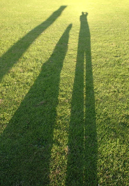 Sombras de três pessoas — Fotografia de Stock