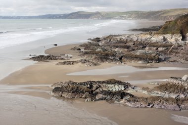 Rock and sandy beach