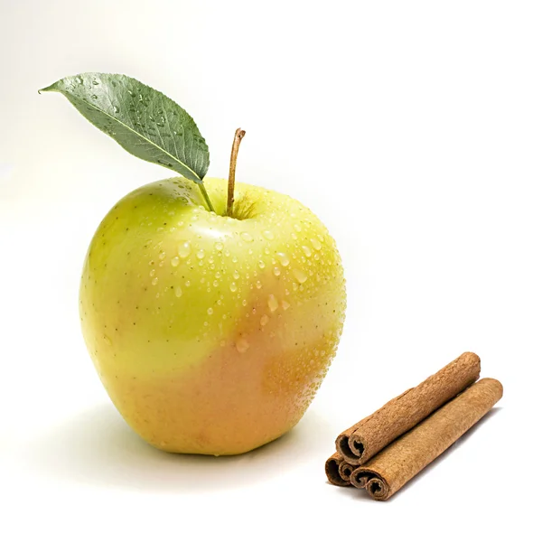 Apple with water drops and cinnamon — Stock Photo, Image