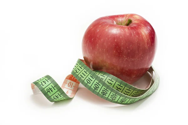 stock image Red apple measured the meter