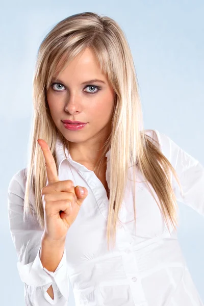 Woman pointing with her finger — Stock Photo, Image
