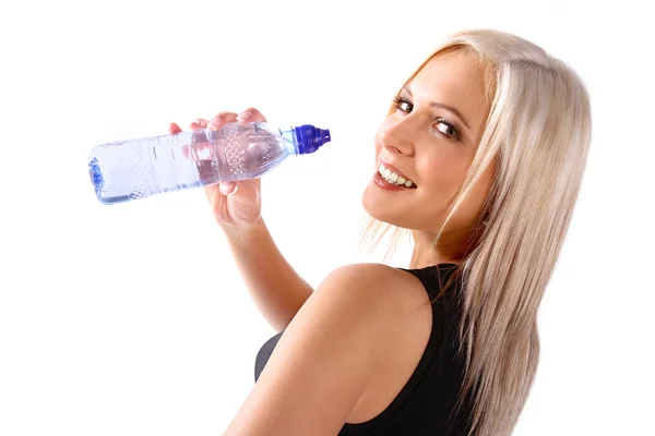 stock image Woman in fitness attire holding water bo