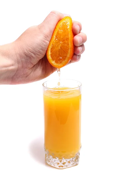 Orange main et jus en verre — Photo