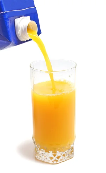 Orange juice in packing and glass — Stock Photo, Image
