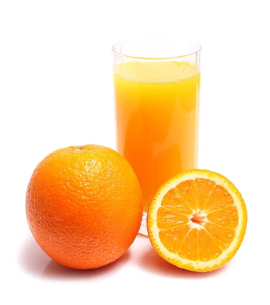 Apelsin och juice i glas Stockfoto