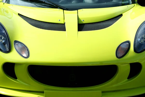 Isolated yellow sports car on black — Stock Photo, Image