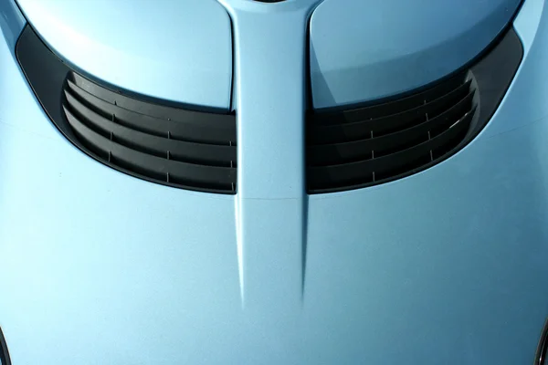 Niebieski samochód sportowy kaptur z gałką — Zdjęcie stockowe