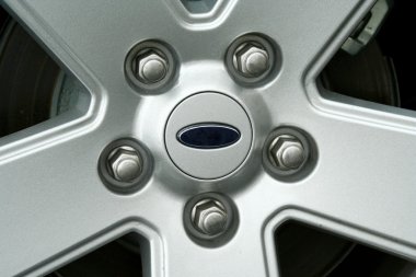 Car tire wheel and lug nuts clipart