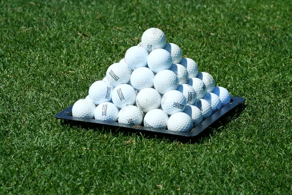 Pyramid of practice golf balls — Stock fotografie