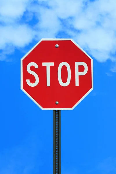 Stop sign on blue sky backgound — Zdjęcie stockowe
