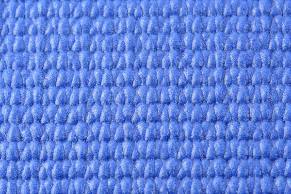 Vista macro de um tapete de ioga azul — Fotografia de Stock
