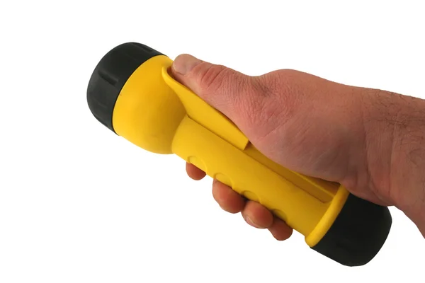 Hand hält eine gelbe Taschenlampe — Stockfoto