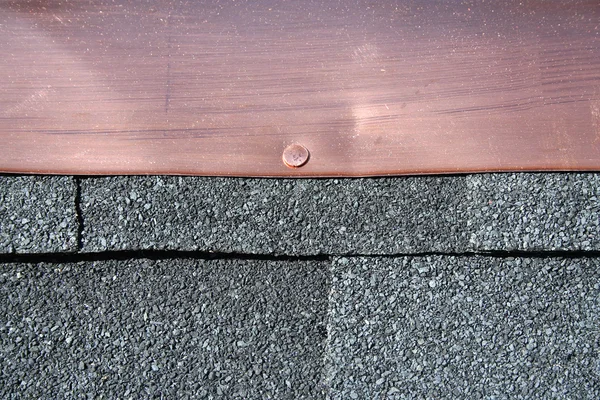 Black asphalt roofing shingles with copp — Stock Photo, Image