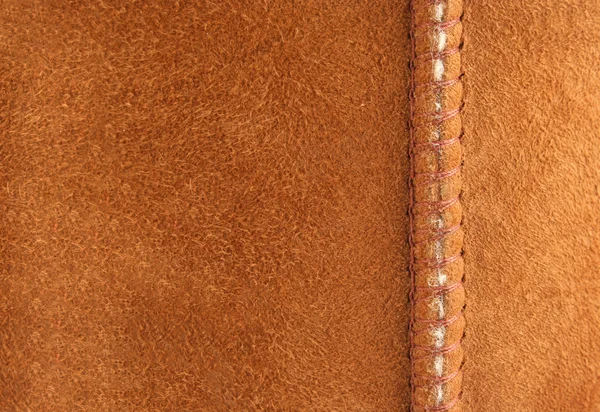 Un fondo de ante marrón con costura — Foto de Stock