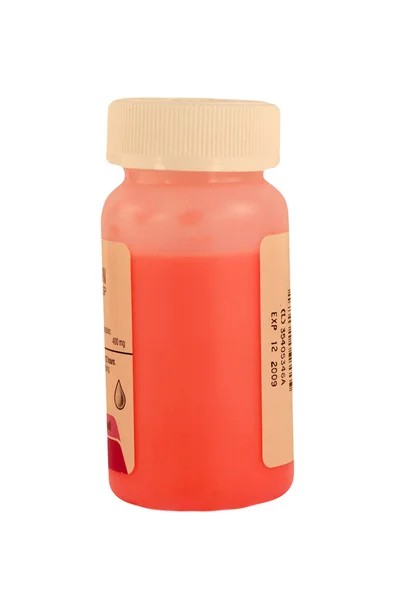 Geïsoleerde childrens roze geneeskunde fles — Stockfoto