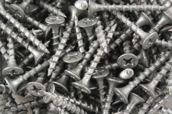 Silver screws background — Stock Photo, Image