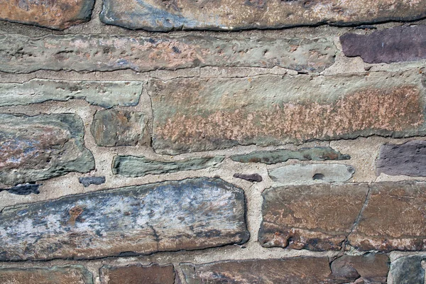 Vieux mur de bâtiment de roche — Photo