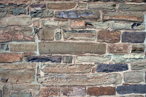 Vieux mur de bâtiment de roche — Photo