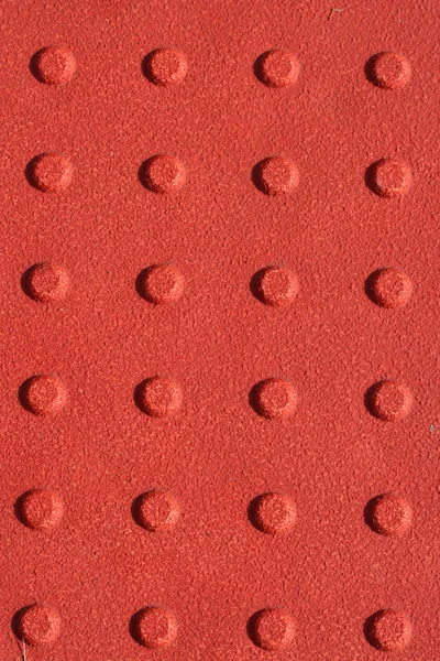Piros járdán csúszásgátló pad háttér — Stock Fotó