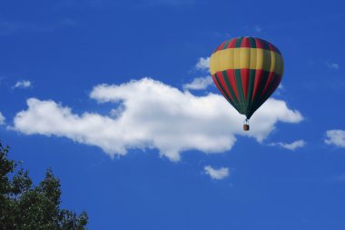 Hot air balloon and clouds clipart
