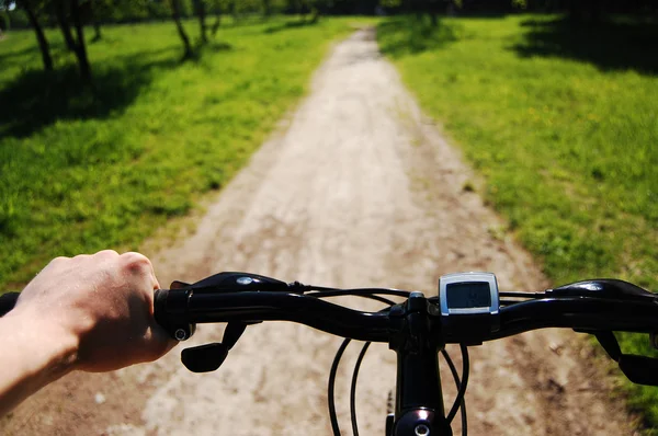 stock image Man's hand on a bike handle bar