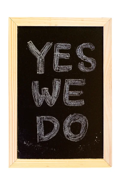 Доска написано: "Да, мы делаем " — стоковое фото