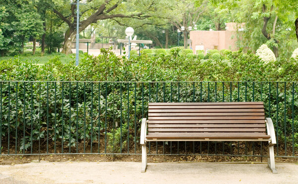 Brown bench with nobody in the park