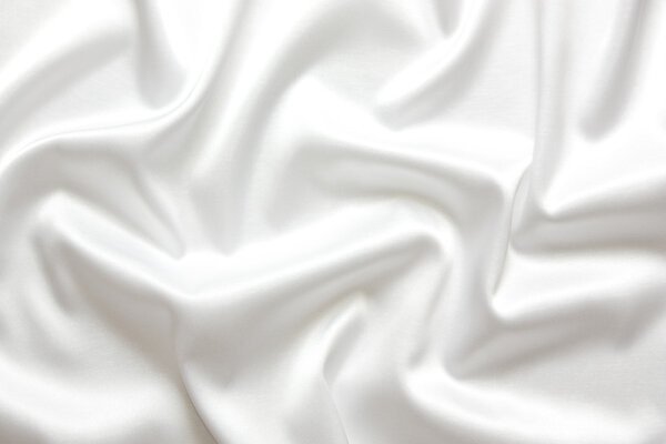 Белый шелковый текстильный фон
