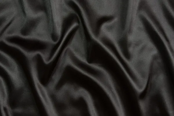 Zwarte zijden textiel achtergrond — Stockfoto