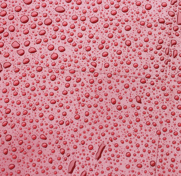 stock image Red plastic during a rain. Background