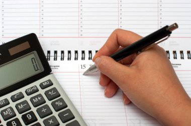 Calculator, organizer and pen clipart