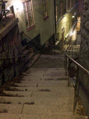 Alley with stairs at night clipart