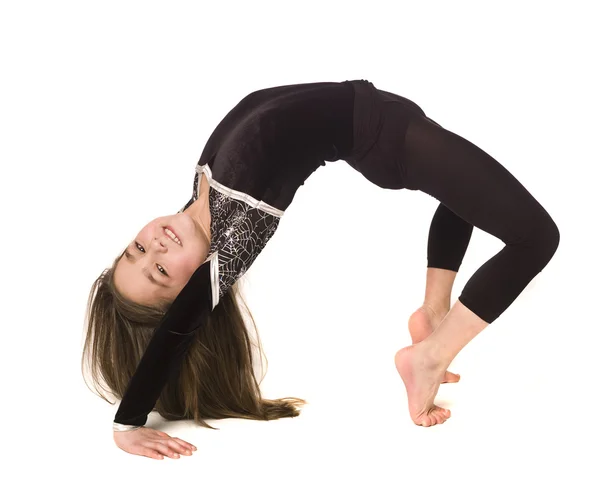 Mladá dívka dělá gymnastiku — Stock fotografie