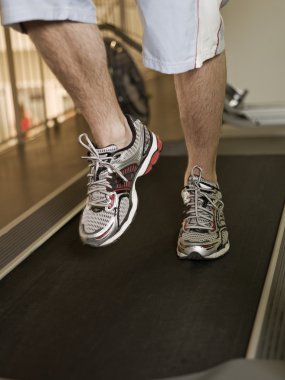 Man running on a treadmill clipart