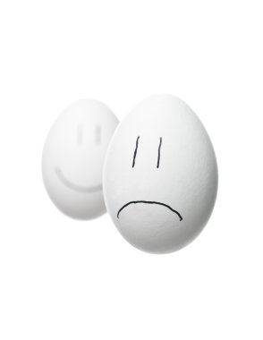 Sad face and a happy face out of focus clipart