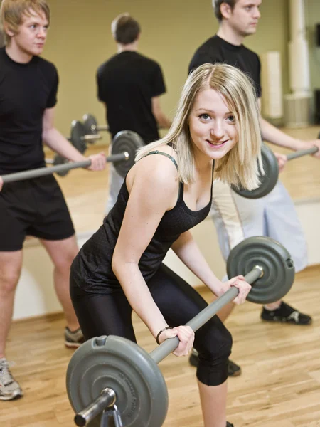 Girl lifting weights — Stock Photo, Image