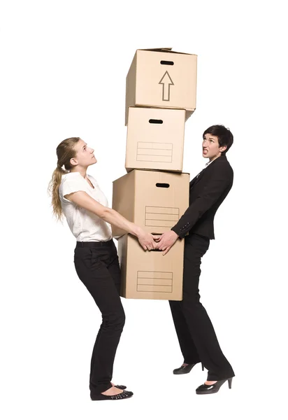 Donne che trasportano scatole — Foto Stock