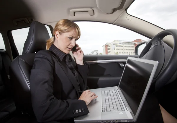 Woman in her car — Stock Photo, Image